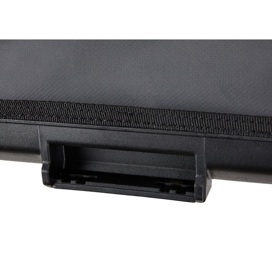 Close-up of a black DEWALT case latch with textured surface and fabric edge detail.