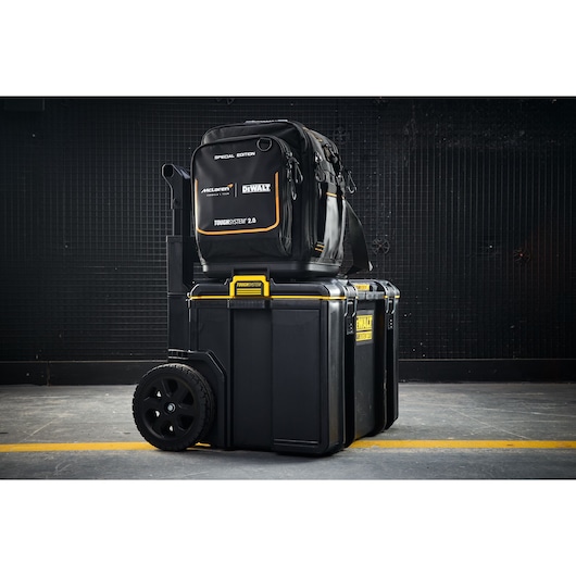 DEWALT ToughSystem 2.0 rolling toolbox with a McLaren special edition backpack stacked on top.