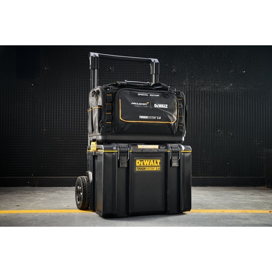 DEWALT ToughSystem 2.0 toolboxes with a special edition bag stacked, shown in an industrial setting.