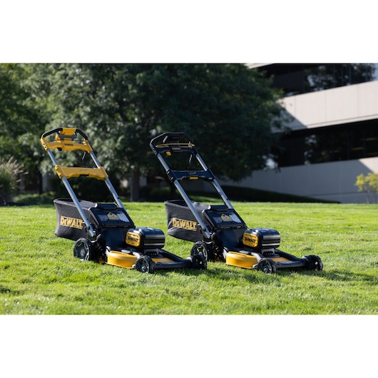 DEWALT lawn mowers on grass. Shown: DCMWP134N, DCMWP134W2, DCMWSP156N, DCMWSP156W2. Photography category.