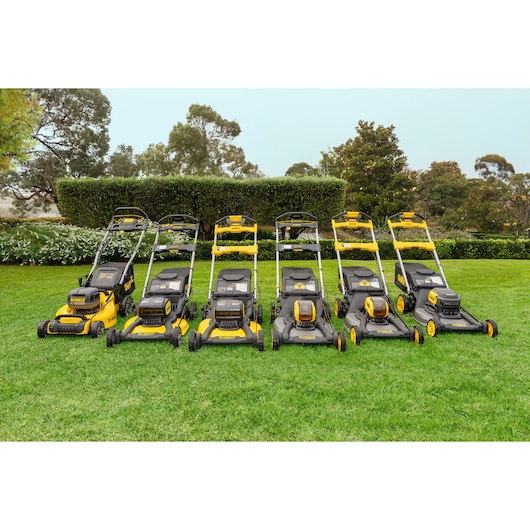 DEWALT lawn mowers DCMWSP660Z2-XE, DCMWSP156W2-XE, DCMWSP550Z1-XE, DCMWP500X1-XE, DCMW564P2-XE, DCMWP134P2-XE lined up.